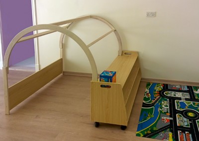 Nursery furniture den with shelves