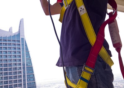 Installing balcony safety netting requires safety harness
