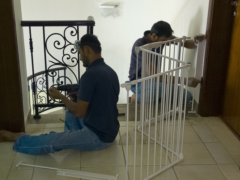 installing a safety gate at the top of the stairs