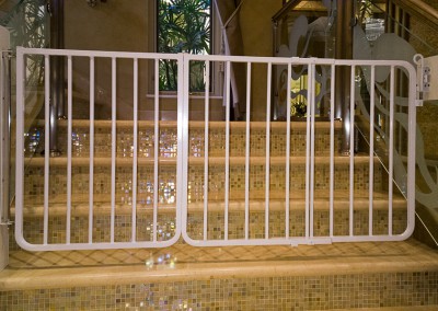safety gates at foot of staircase in Emirates Hills